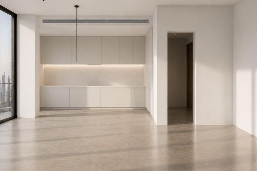 The living area at handover: empty, with white walls and a bare floor