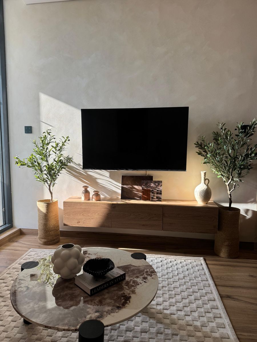 The TV wall and coffee table in afternoon light