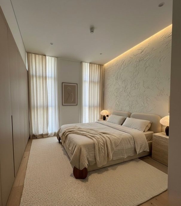 Bedroom option B: a sculpted textured wall, a padded headboard and a chunky wool rug