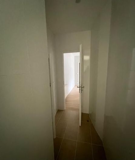 The bathroom entrance before, empty
