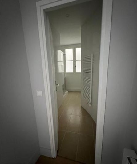 The corridor to the bathroom before, empty