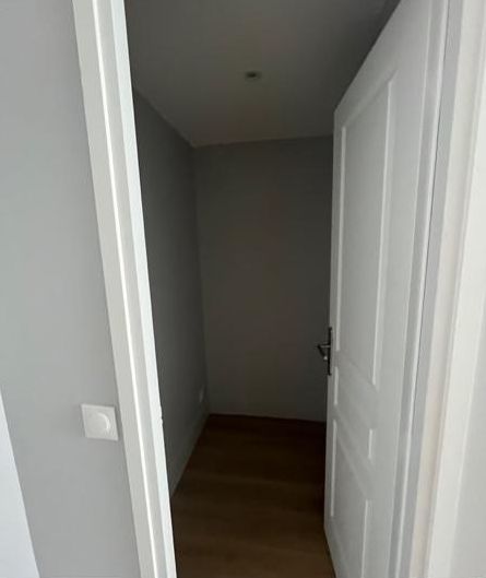 The walk-in closet before: empty, with bare walls
