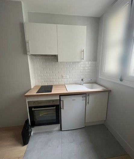 The kitchen before: bare units and an empty counter